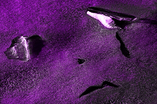 Sad Teardrop Ice Face Appears Atop Frozen River (Purple Tone Photo)