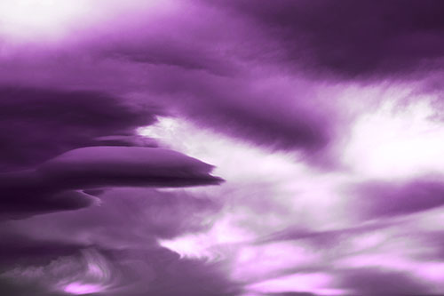 Smooth Cloud Sails Along Swirling Formations (Purple Tone Photo)