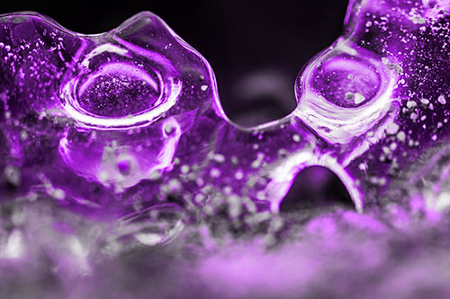 Vertical Bubble Eyed Screaming Ice Face Along Frozen River (Purple Tone)