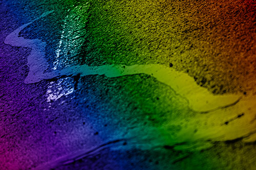 Slithering Tar Creeps Over Pavement Marking (Rainbow Shade Photo)