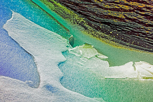 Broken Cracked Ice Along Shoreline (Rainbow Tint Photo)
