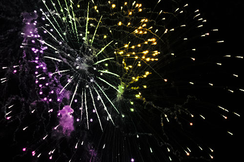 Multiple Firework Explosions Send Light Orbs Flying (Rainbow Tint Photo)