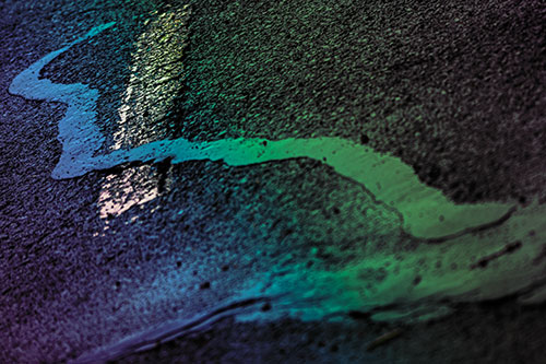 Slithering Tar Creeps Over Pavement Marking (Rainbow Tint Photo)