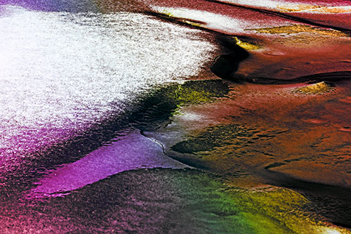 Sloping Ice Melting Atop River Water (Rainbow Tint Photo)