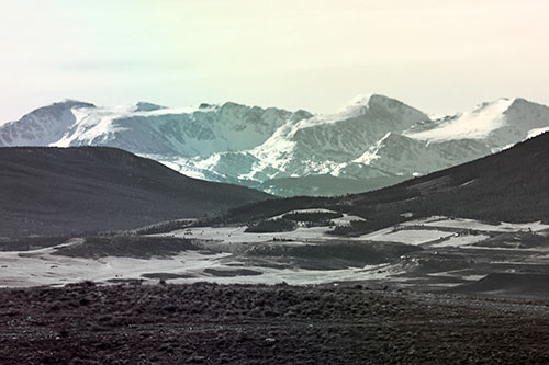 Snow Capped Mountains Behind Hills (Rainbow Tint Photo)