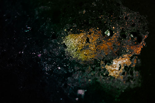 Wide Eyed Oil Demon Face Floating Atop Water (Rainbow Tint)