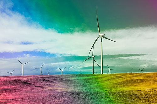 Wind Turbine Cluster Overtaking Hilly Horizon (Rainbow Tint Photo)