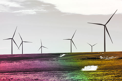 Wind Turbines Scattered Around Melting Snow Patches (Rainbow Tint Photo)