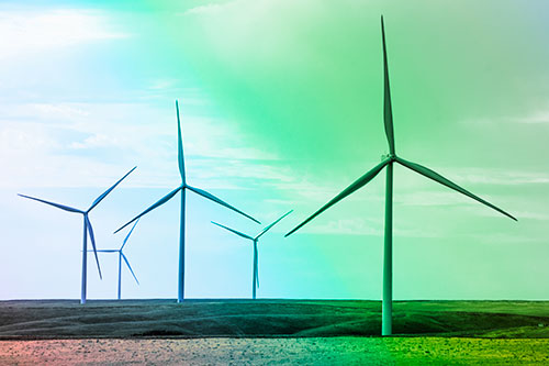 Wind Turbines Standing Tall On Green Pasture (Rainbow Tint Photo)