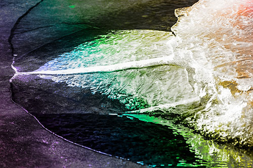 Abstract Ice Sculpture Forms Atop Frozen River (Rainbow Tone Photo)