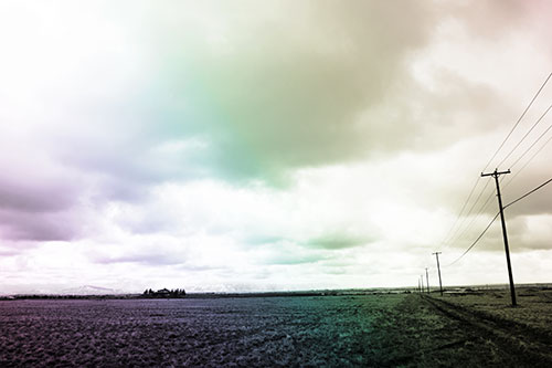 Bleak Clouded Sky Consumes Powerline Prairie (Rainbow Tone Photo)