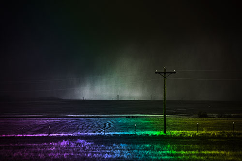 Distant Thunderstorm Rains Down Upon Powerlines (Rainbow Tone Photo)
