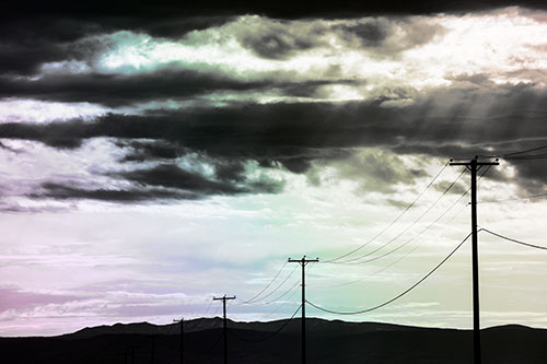 Powerline Silhouette Entering Mountain Range (Rainbow Tone Photo)