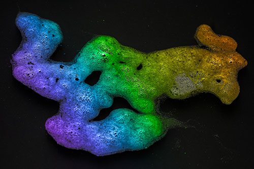 Sorrow Morphing Bubble Face Floating Above Soil (Rainbow Tone)