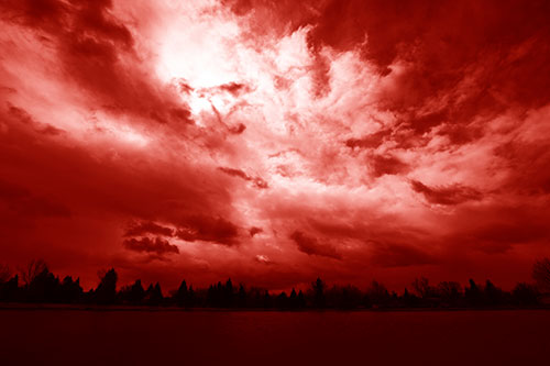 Clouds Spiraling Above Dark Lit Lake (Red Shade Photo)