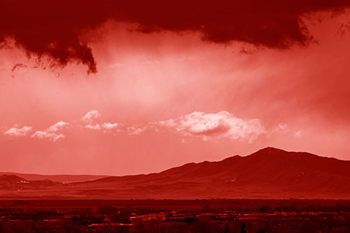 Dark Cloud Mass Above Mountain Range Horizon (Red Shade Photo)