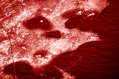 Disintegrating Ice Face Melting Among Flowing River Water (Red Shade)