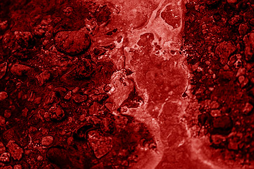 Distorted Oil Face Smearing Among Rocky Shore (Red Shade)