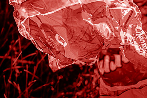 Growling Plastic Charmin Bag Among Grass (Red Shade)