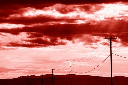 Powerline Silhouette Entering Mountain Range (Red Shade Photo)