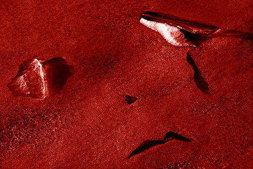 Sad Teardrop Ice Face Appears Atop Frozen River (Red Shade)