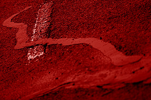 Slithering Tar Creeps Over Pavement Marking (Red Shade Photo)