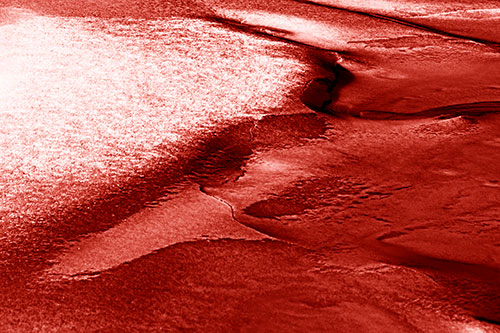 Sloping Ice Melting Atop River Water (Red Shade Photo)