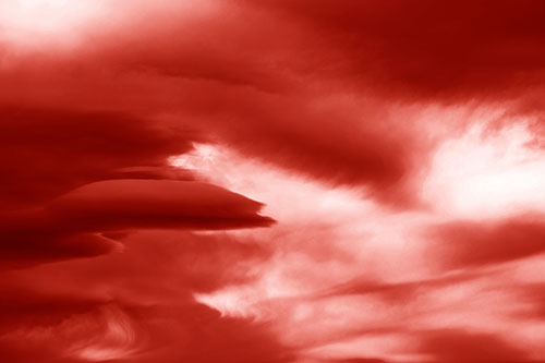 Smooth Cloud Sails Along Swirling Formations (Red Shade Photo)
