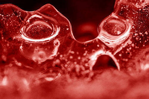 Vertical Bubble Eyed Screaming Ice Face Along Frozen River (Red Shade Photo)