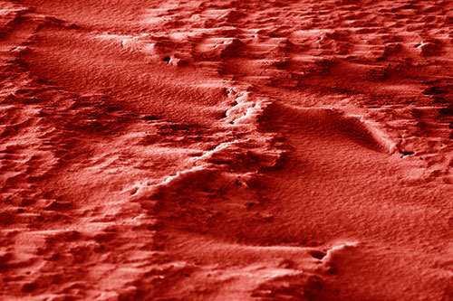 Wind Blowing Across Jagged Frozen Snow Drift (Red Shade Photo)