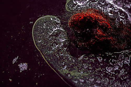 Angry Eyebrow Raised Ice Bubble Creature Bending Beside Mossy Rock (Red Tint)