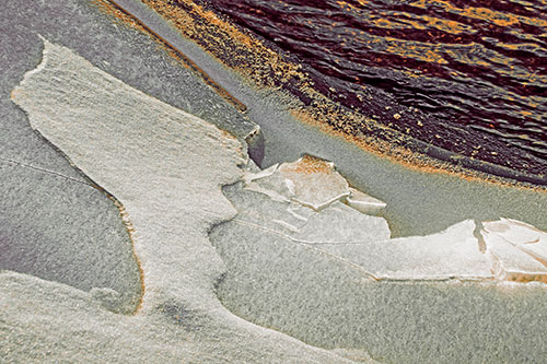 Broken Cracked Ice Along Shoreline (Red Tint Photo)