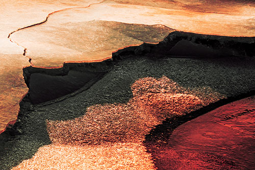 Cracked Ice Frozen Shoreline Melting (Red Tint)