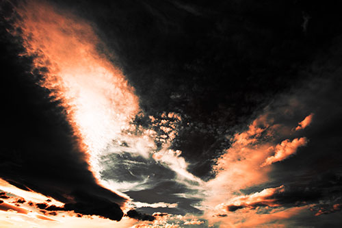 Curving Black Charred Sunset Clouds (Red Tint Photo)