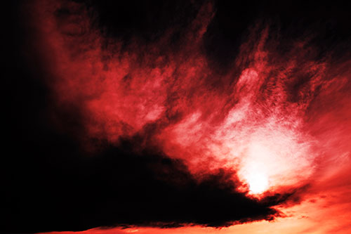 Dark Cloud Mass Holding Sun (Red Tint Photo)