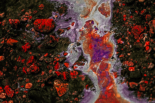 Distorted Oil Face Smearing Among Rocky Shore (Red Tint)
