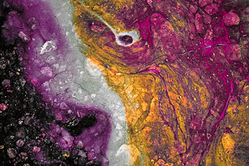 Distressed Oil Face Swirling Among Rocky Shore (Red Tint)