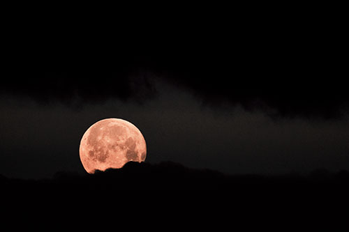 Easter Morning Moon Peeking Through Clouds (Red Tint)