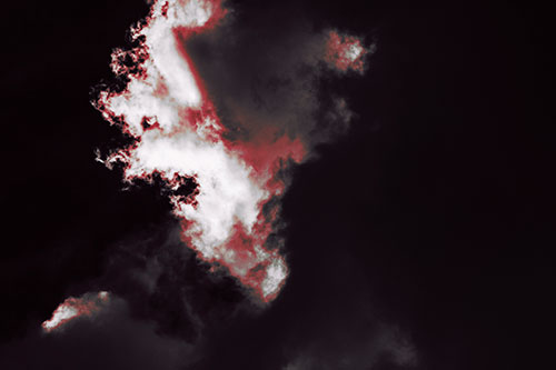 Evil Cloud Face Snarls Among Sky (Red Tint Photo)