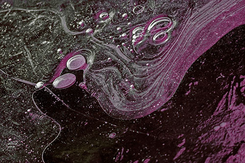 Frozen Bubble Clusters Among Twirling River Ice (Red Tint)