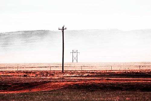 Heavy Fog Hiding Mountain Range Behind Powerlines (Red Tint Photo)