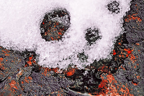 Ice Skull Snow Face Melting Atop Rock (Red Tint Photo)