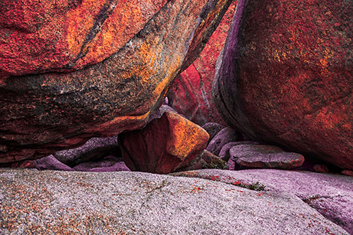 Large Crowded Boulders Leaning Against One Another (Red Tint Photo)