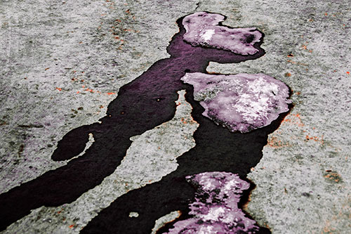 Melting Ice Puddles Forming Water Streams (Red Tint Photo)