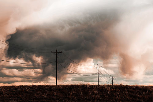 Rainstorm Clouds Twirl Beyond Powerlines (Red Tint)
