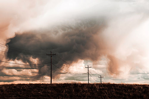 Rainstorm Clouds Twirl Beyond Powerlines (Red Tint Photo)