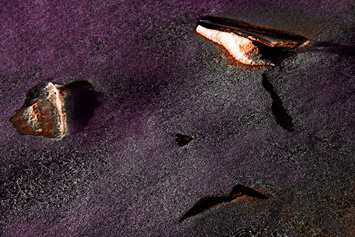 Sad Teardrop Ice Face Appears Atop Frozen River (Red Tint Photo)