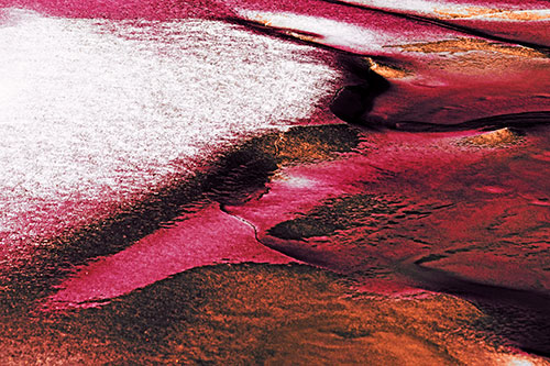 Sloping Ice Melting Atop River Water (Red Tint Photo)