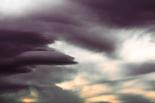 Smooth Cloud Sails Along Swirling Formations (Red Tint Photo)