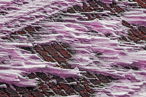 Snow Drifts Atop Rigid Pavement (Red Tint Photo)